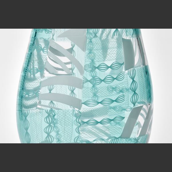 art glass vase in turquoise and white with modern line patterns