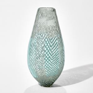 art glass vase in light green and grey with various external lined patterns