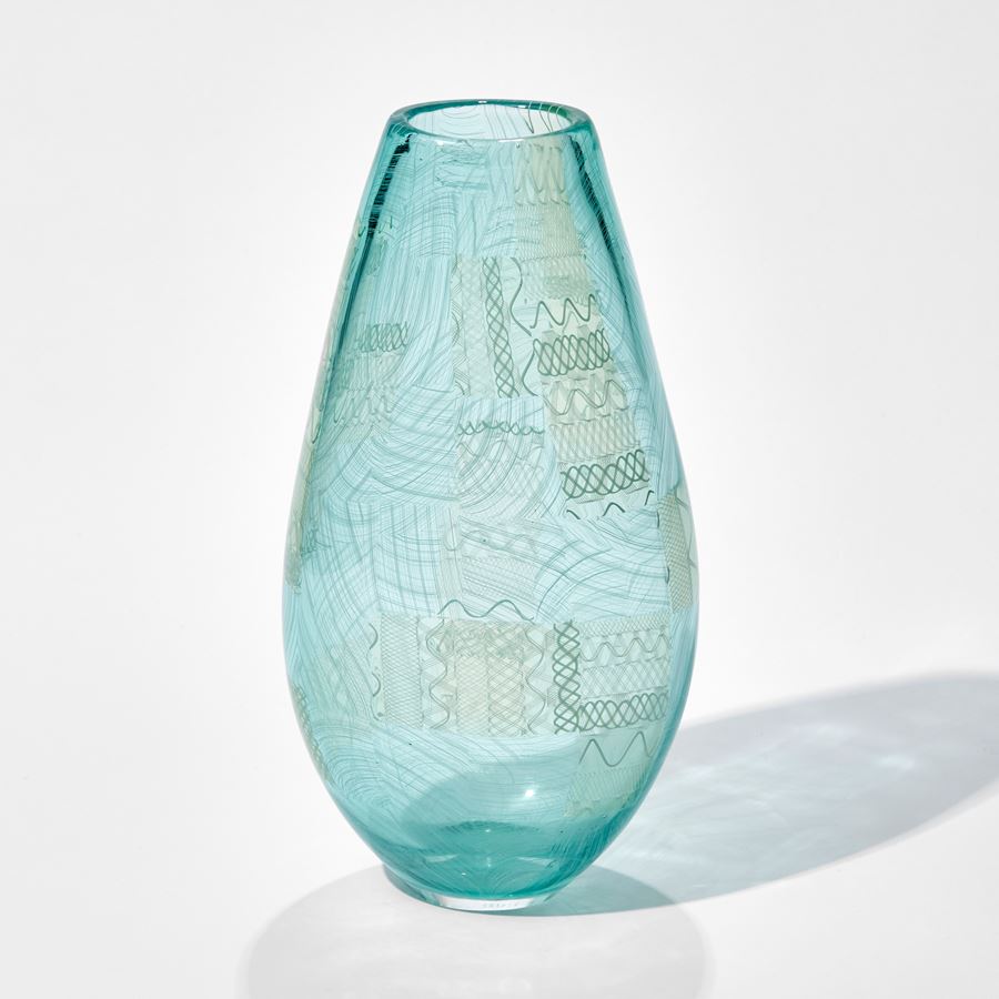 light blue art glass vase with faint green tint and faint lined pattern