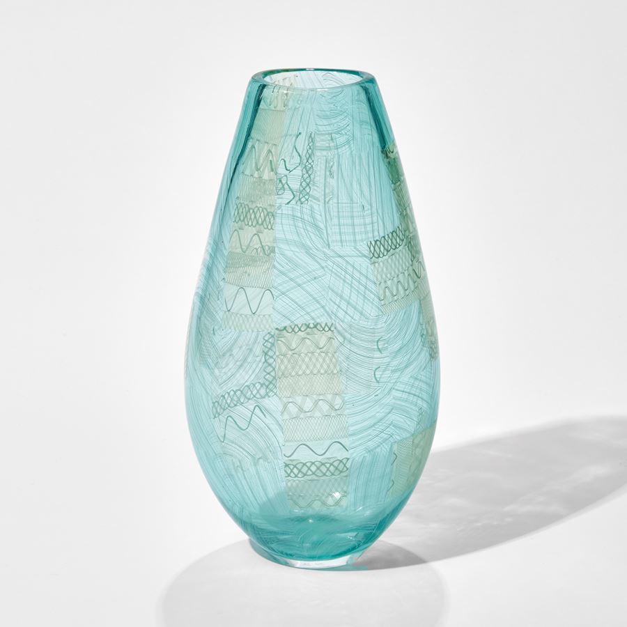 light blue art glass vase with faint green tint and faint lined pattern