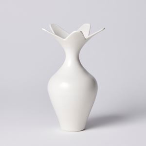 white classically shaped vase with wide five pointed star shaped opening hand made from porcelain