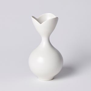 white classically shaped vase with flower shaped opening with three petals hand made from porcelain