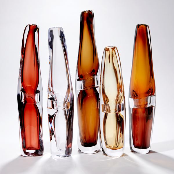 tall transparent warm brown vase with organic lines and central clear band handblown from glass