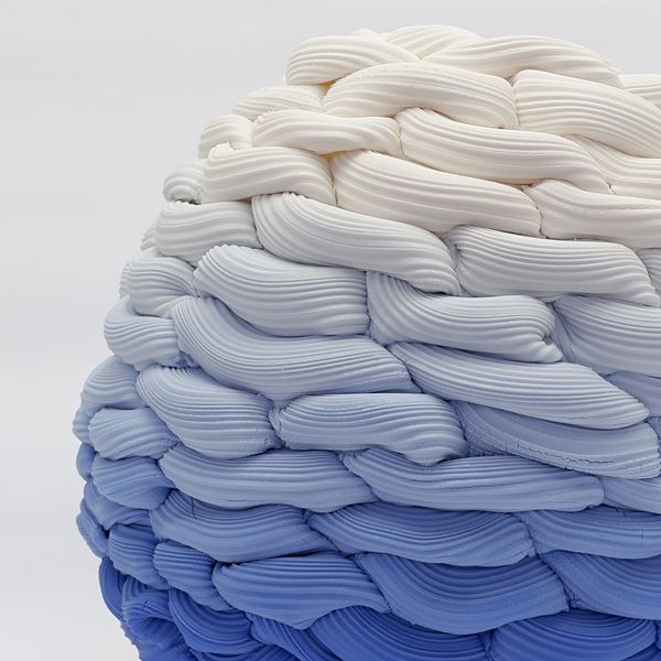 beehive woven form with small top aperture fading from dark blue at the base to off white at the top hand made from parian porcelain