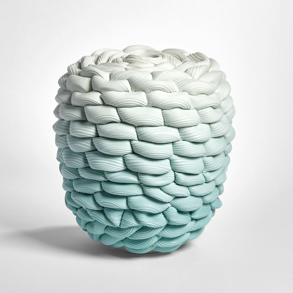 teal aqua fading to off white chunky woven and ridged vessel in a flat topped barrel shape hand made from parian porcelain