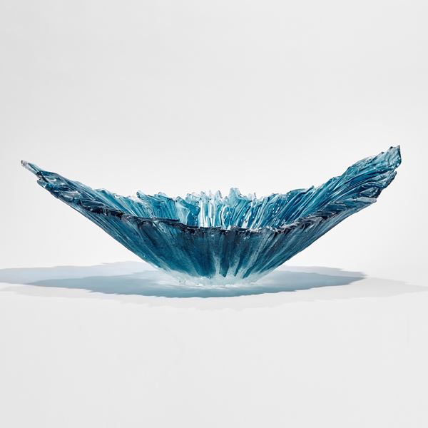 aqua blue and ice blue oval ridged sculptural bowl with raised ends and rippled interior hand made from glass