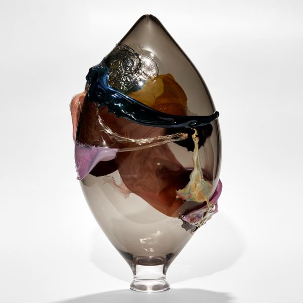 pointed teardrop shaped vase in smokey transparent grey with relief organic textural detail in teal egg yellow bubblegum pink and purple handmade from glass