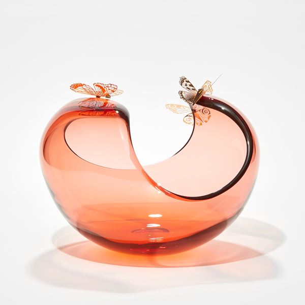 low round peach centrepiece with curved sweeping dropping rim with three gold butterflies perched on the edge hand made from glass steel and gold