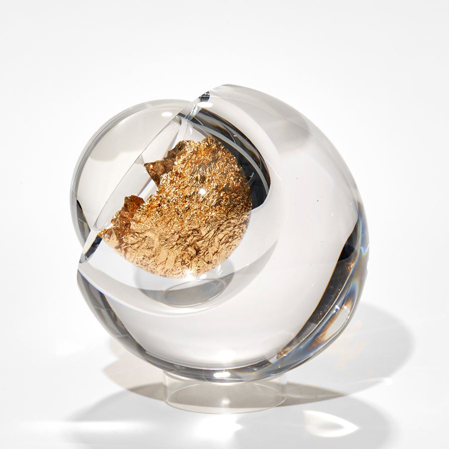 clear round orb with interior bubble filled with crushed gold leaf with front unremovable lens lid magnifying the contents hand made from glass