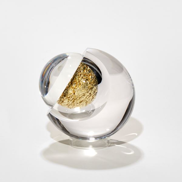 glass orb filled with crushed citron gold leaf hand made from blown and cut glass