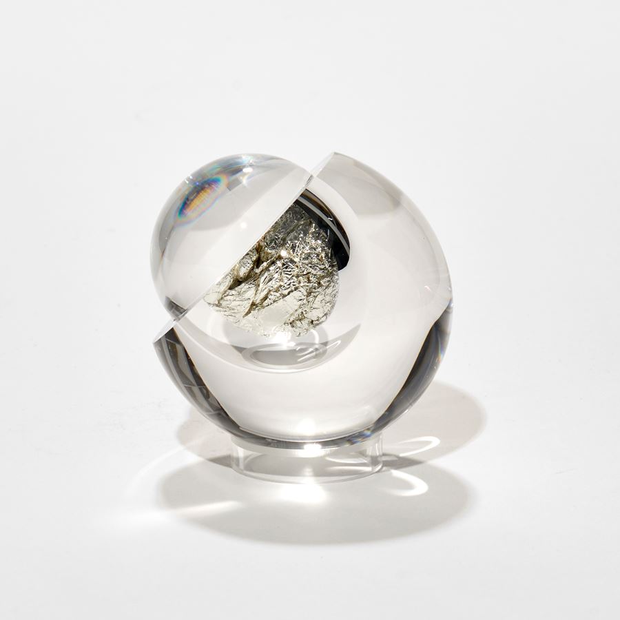 round glass ball with hollow centre will with crunched up white gold leaf with fixed magnifying lens lid hand made from glass