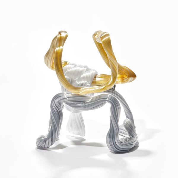 looped ridged candy canes in white amber and grey creating a standing form handmade from glass