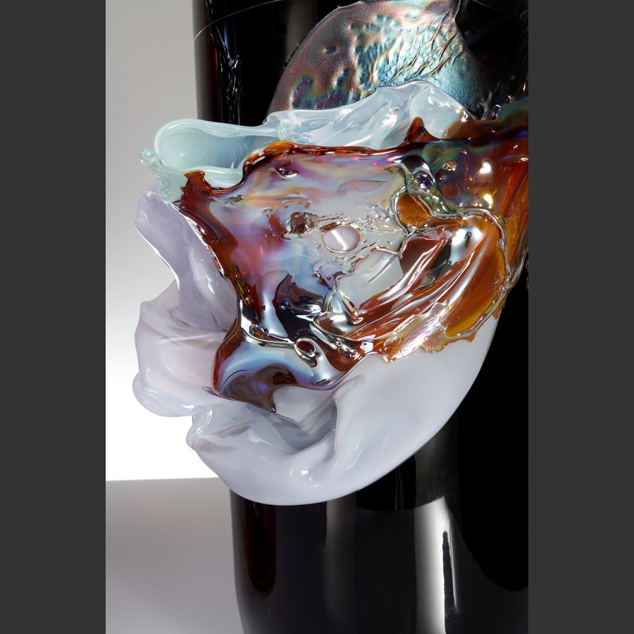 rick black brown transparent cylindrical vase with tapering neck with central organic raised band in iridescent lilac amber blue and jade mimicking a roushed band of silk fabric handmade from glass