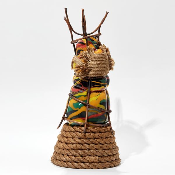 african abstract regal figurative sculpture created  from blown glass with copper and coiled rope on black green orange red and yellow