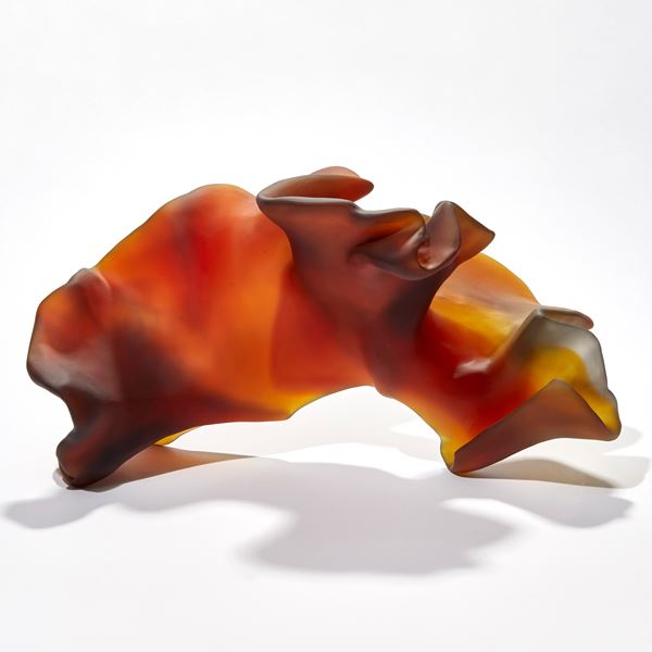 rich dark amber abstract organic sculpture with the appearance of a piece of simplified coral or seaweed hand made from glass