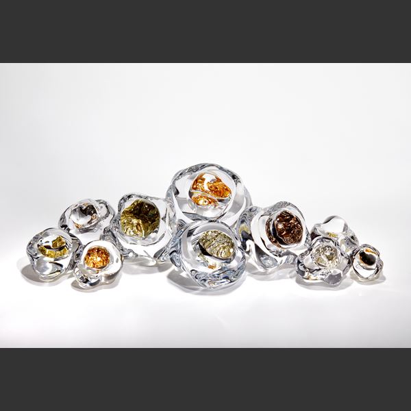 organic clear boulder with hollow centre filled with 22ct moon gold hand blown and sculpted from glass