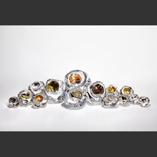 amorphous clear boulder with centre filled with gold leaf hand blown and sculpted from glass