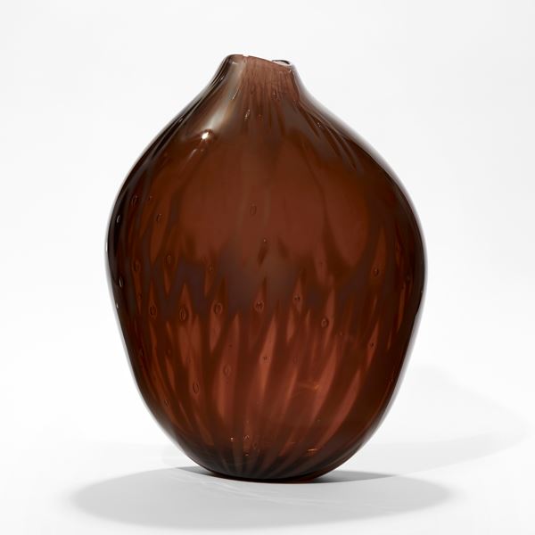 rich dark plum coloured vessel with subtle organic surface texture with amorphic shape and offset top opening hand made from glass