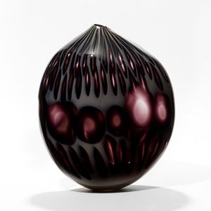 asymmetric dark purple and milky grey hand blown glass vessel resembling an abstract poppy seed head