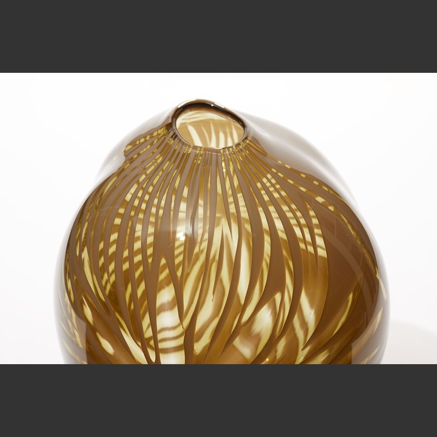 organic round vase in ochre mustard rich yellow with clear feathered see through sections hand made from glass