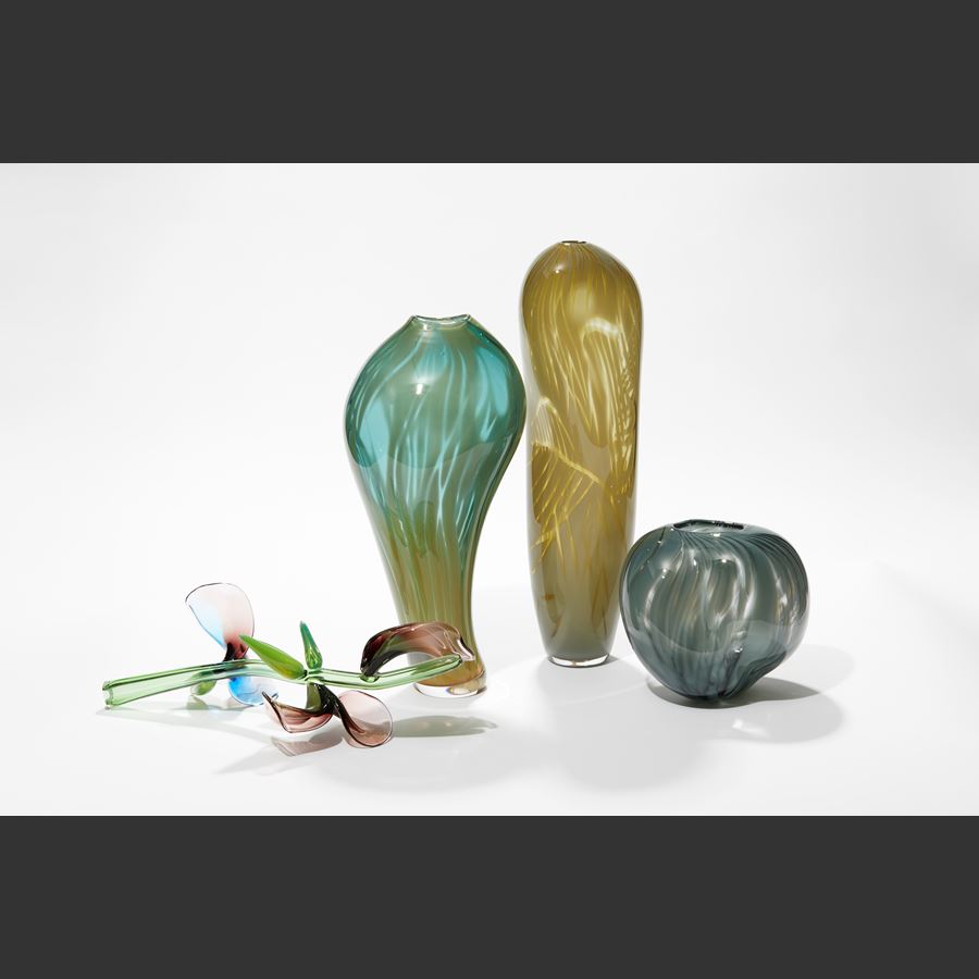 tall opaque olive green brown amorphic vessel with soft feathery line surface patterns hand made from blown glass