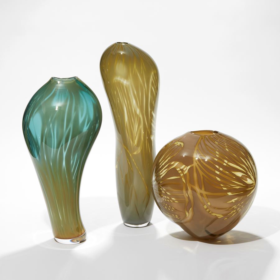 tall opaque olive green brown amorphic vessel with soft feathery line surface patterns hand made from blown glass