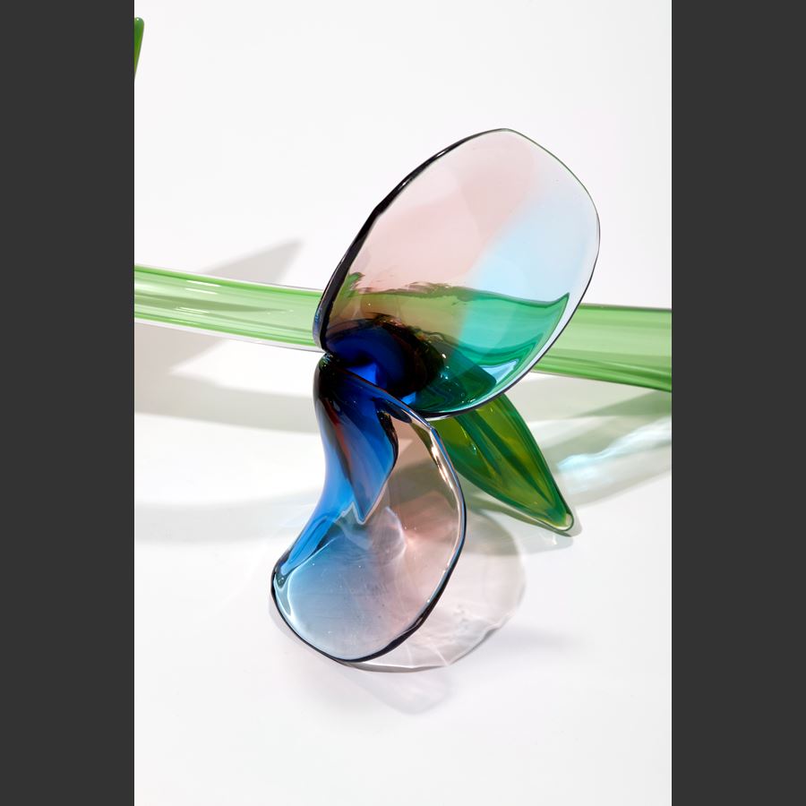 prone stem with abstract flowers and leaves in green pink aubergine and blue hand sculpted from blown glass