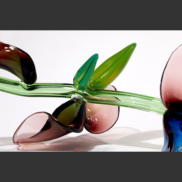 prone stem with abstract flowers and leaves in green pink aubergine and blue hand sculpted from blown glass