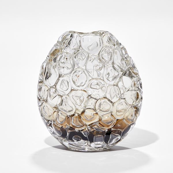 oval hand blown glass vase in clear fading to rich fawn brown at the very base covered in oversized bubbles