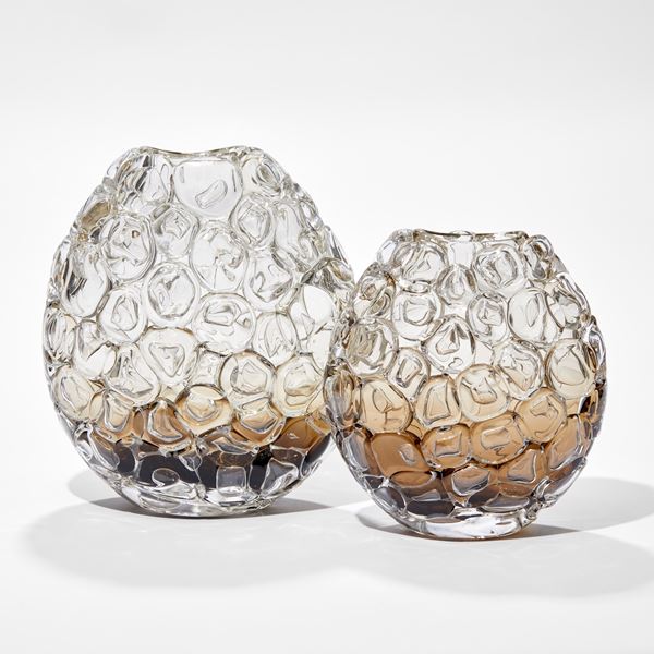 oval hand blown glass vase in clear fading to rich fawn brown at the very base covered in oversized bubbles