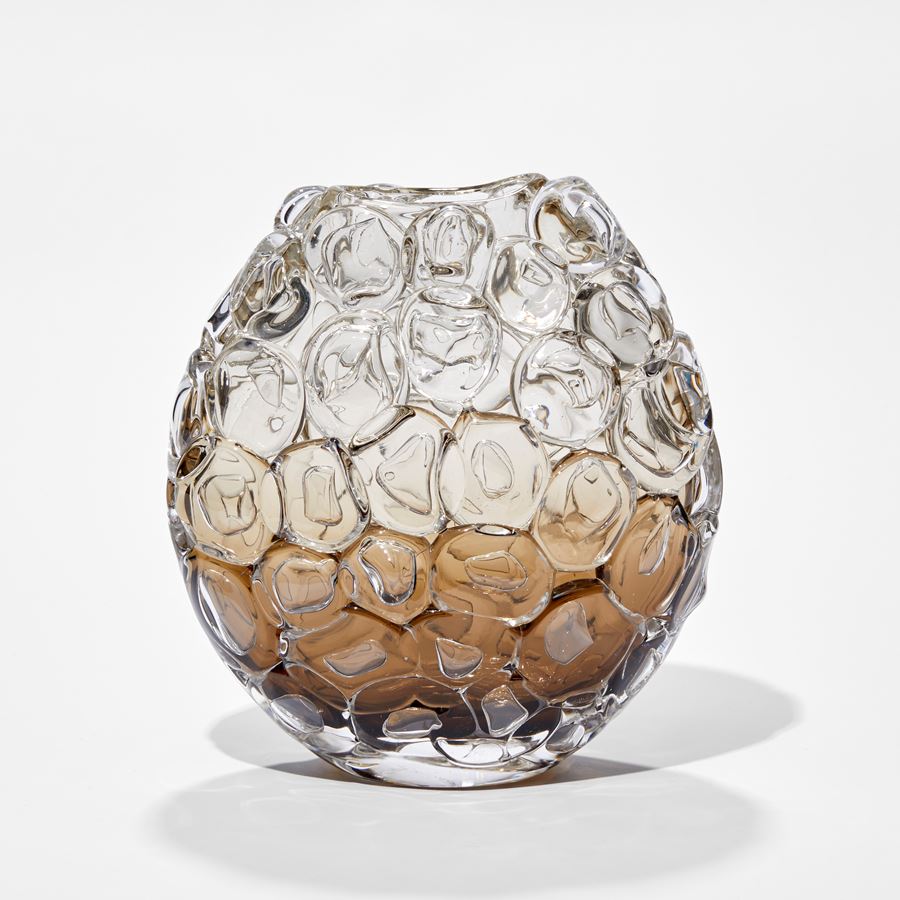 small oval hand blown glass vase covered in oversized bubbled with transparent top fading to fawn and dark brown