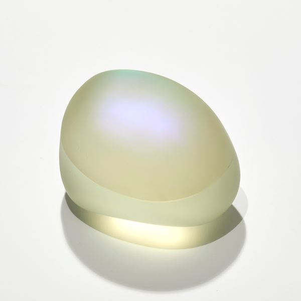 satin smooth finished soft yellow pebble with inner colours glowing outwards hand made and sculpted from cast glass