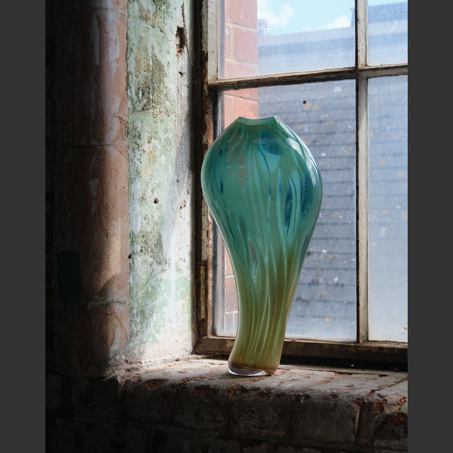 asymmetric olive and jade tall curved with bulbous top vase with soft feathery surface decoration hand blown from glass