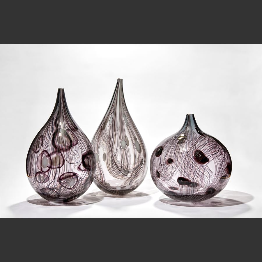 transparent grey and bronze with opaque white dots teardrop shaped vase hand blown from glass