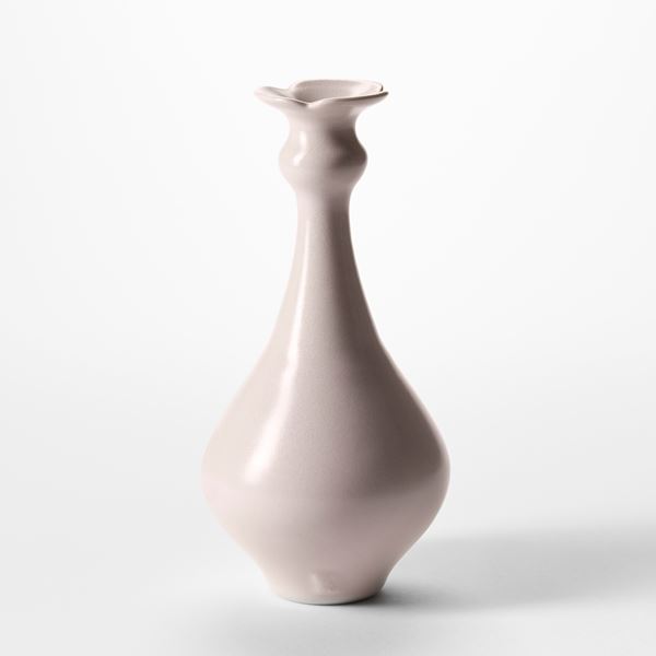 soft pastel pink trio of porcelain bottles with rounded bases thinning necks and flared rims hand thrown