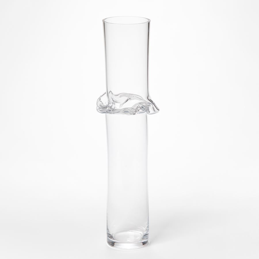 tall uneven clear cylindrical sculpture with flared and rippling waisted joint section hand blown from glass