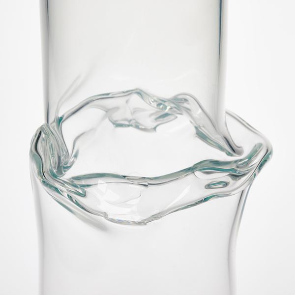 soft transparent cylinder with a hint of light green colouring with a jointed banded rippling section a third from the top rim