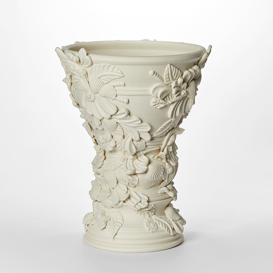 flared off white light cream alabaster vase covered in shells and architectural flourishes hand made from porcelain