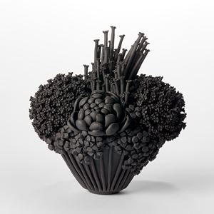 black stoneware sculpted artwork of roses and flowers