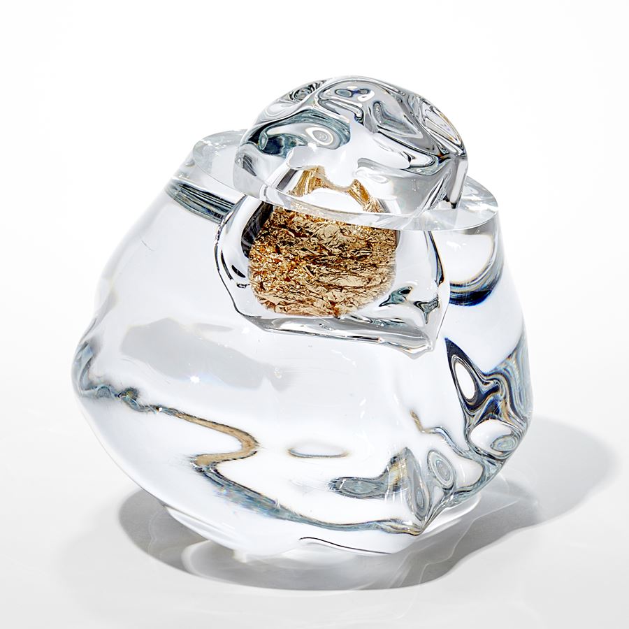 organic amorphous clear mass with internal hallow filled with crumpled gold leaf hand made from glass