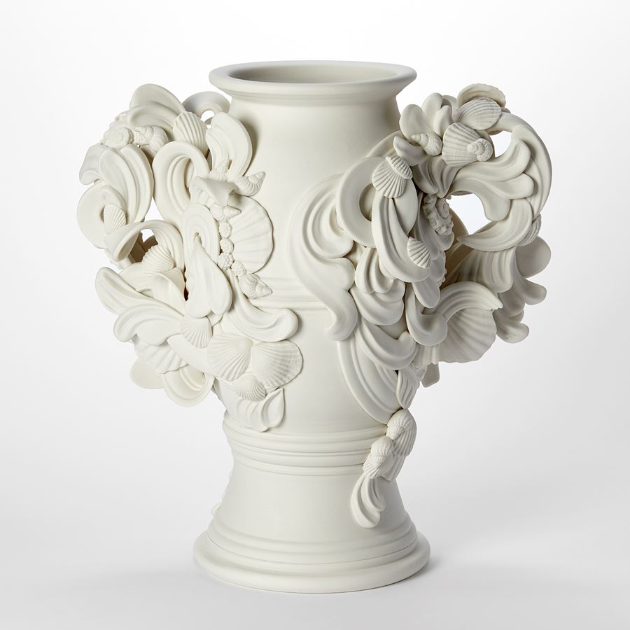 tall thrown rounded porcelain vase garniture vessel with twinned handles covered in flourishes swirls and shells hand made