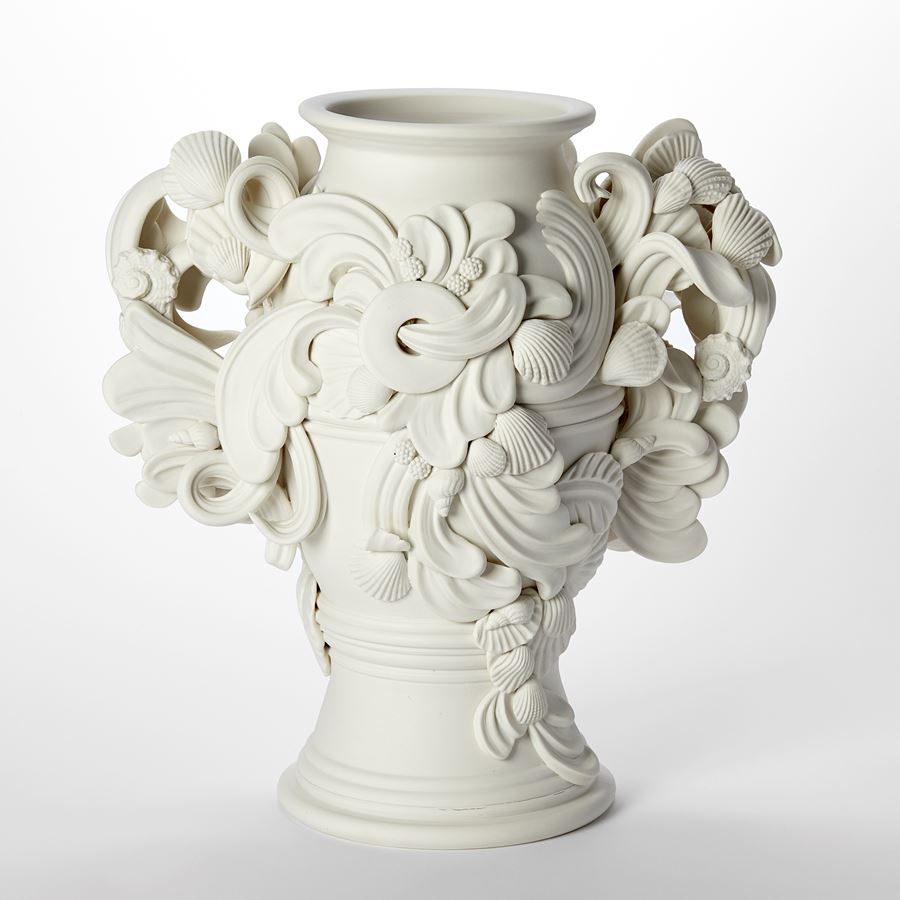 tall thrown rounded porcelain vase garniture vessel with twinned handles covered in flourishes swirls and shells hand made