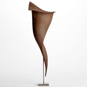 curved wenge wood sculpture with the appearance of a tapered curling piece of parchment held aloft on a stainless steel base