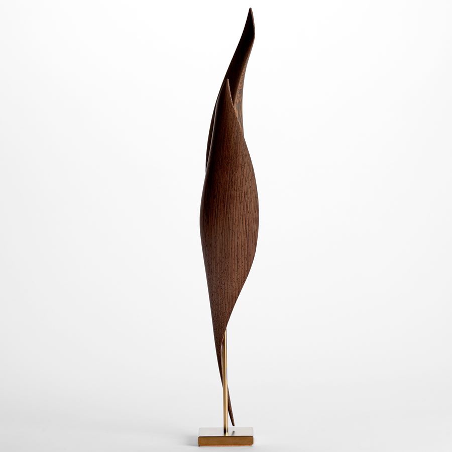 elegant rich highly grained wenge wood barbara hepworth inspired sculpture with sweeping curves and gold inlay on a gold plated stand
