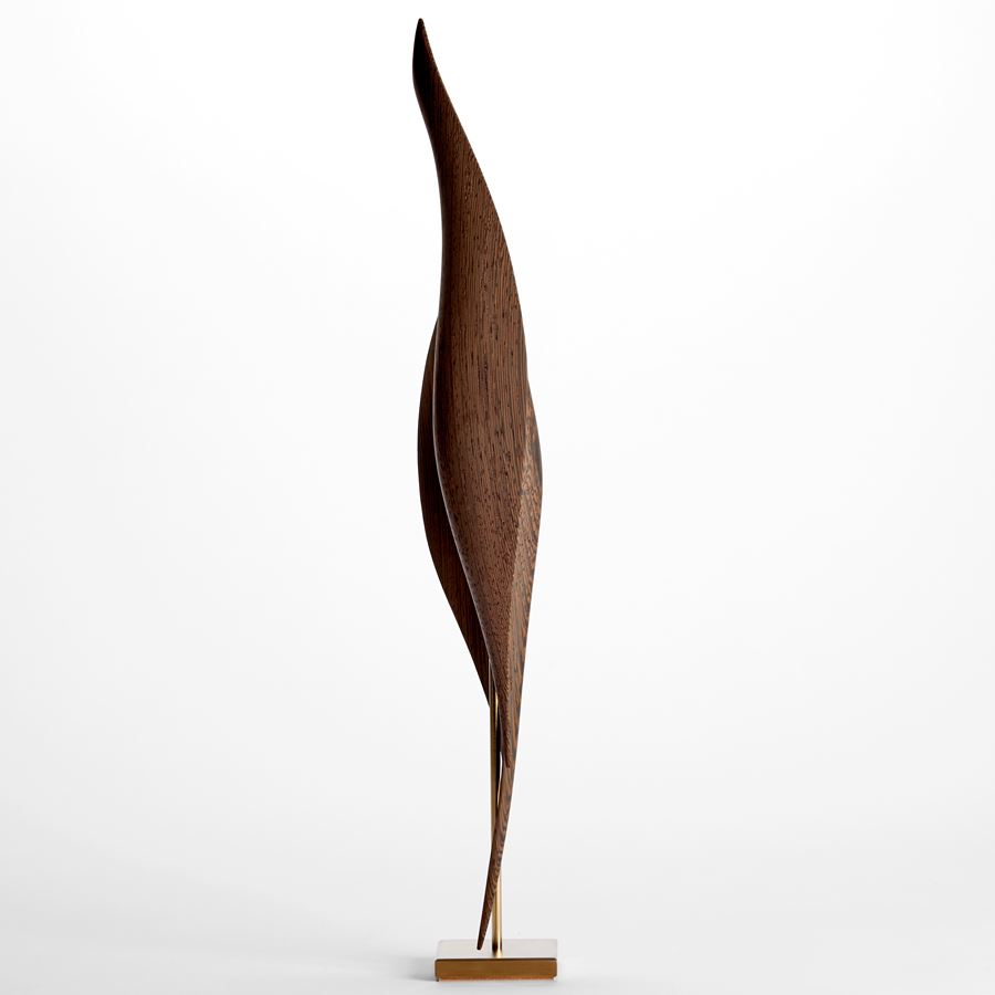 elegant rich highly grained wenge wood barbara hepworth inspired sculpture with sweeping curves and gold inlay on a gold plated stand