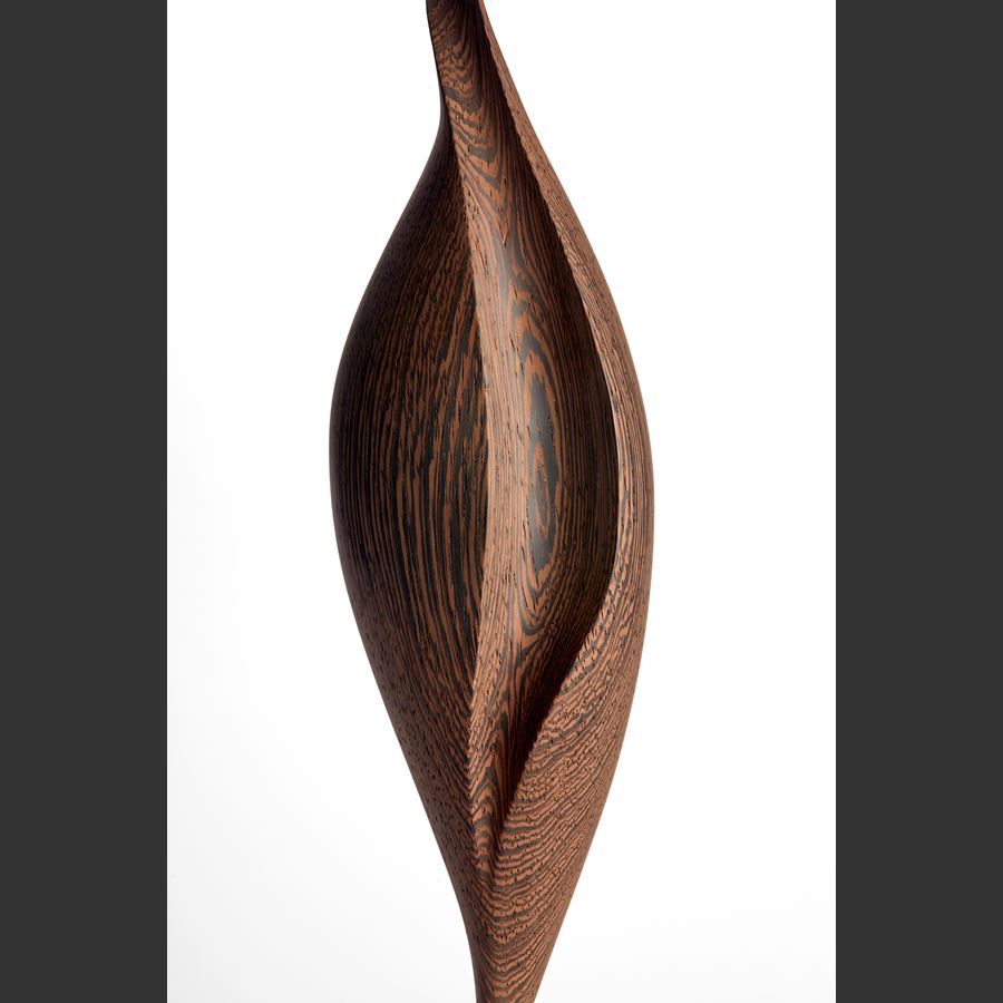 rich dark wenge wood sculpture with swirling dark wood grain and the appearance of an elegant brancusi inspired sleek upright stylised bird with inlaid gold detail and gold plated stand 