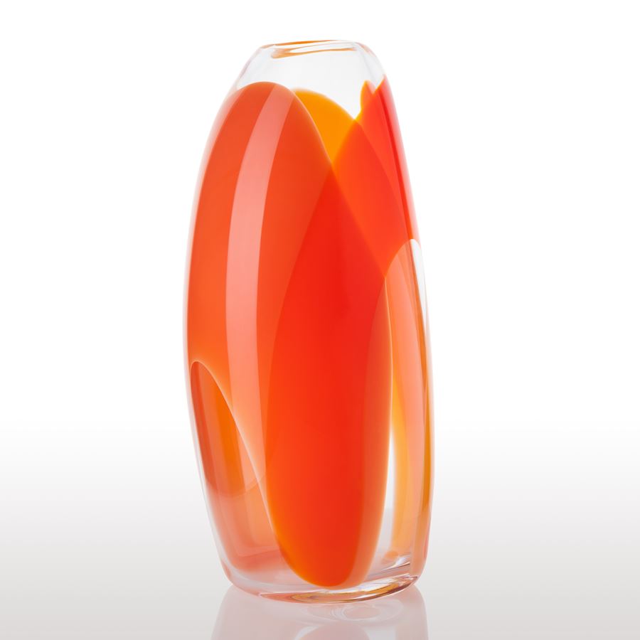 soft tall cylindrical clear vase with wide looped bands of colour in orange red and yellow hand made from glass