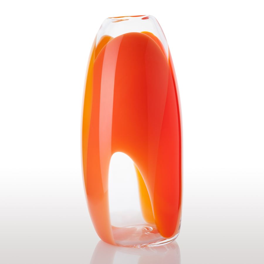soft tall cylindrical clear vase with wide looped bands of colour in orange red and yellow hand made from glass