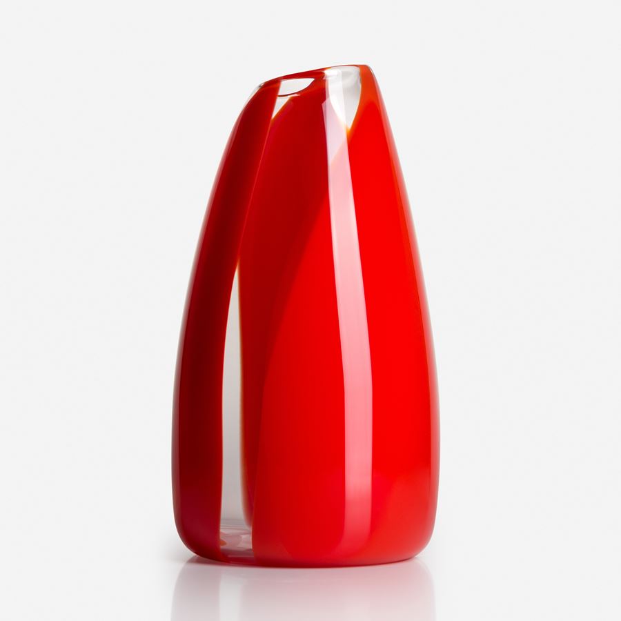 soft tall pointed clear glass vase with abstract thick soft bands of colour in red and orange hand made from blown glass