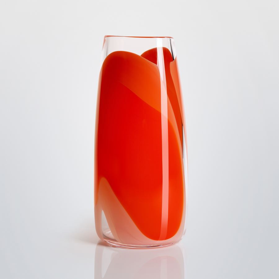tall soft cylinder vase made from hand blown clear glass with wide soft bands of colour in pink peach orange and red